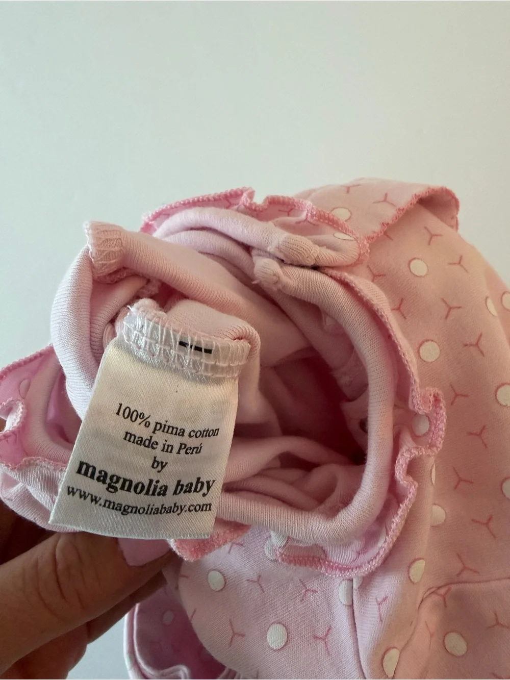 Magnolia baby pink footie with golf cart and golf ball print 3Mo